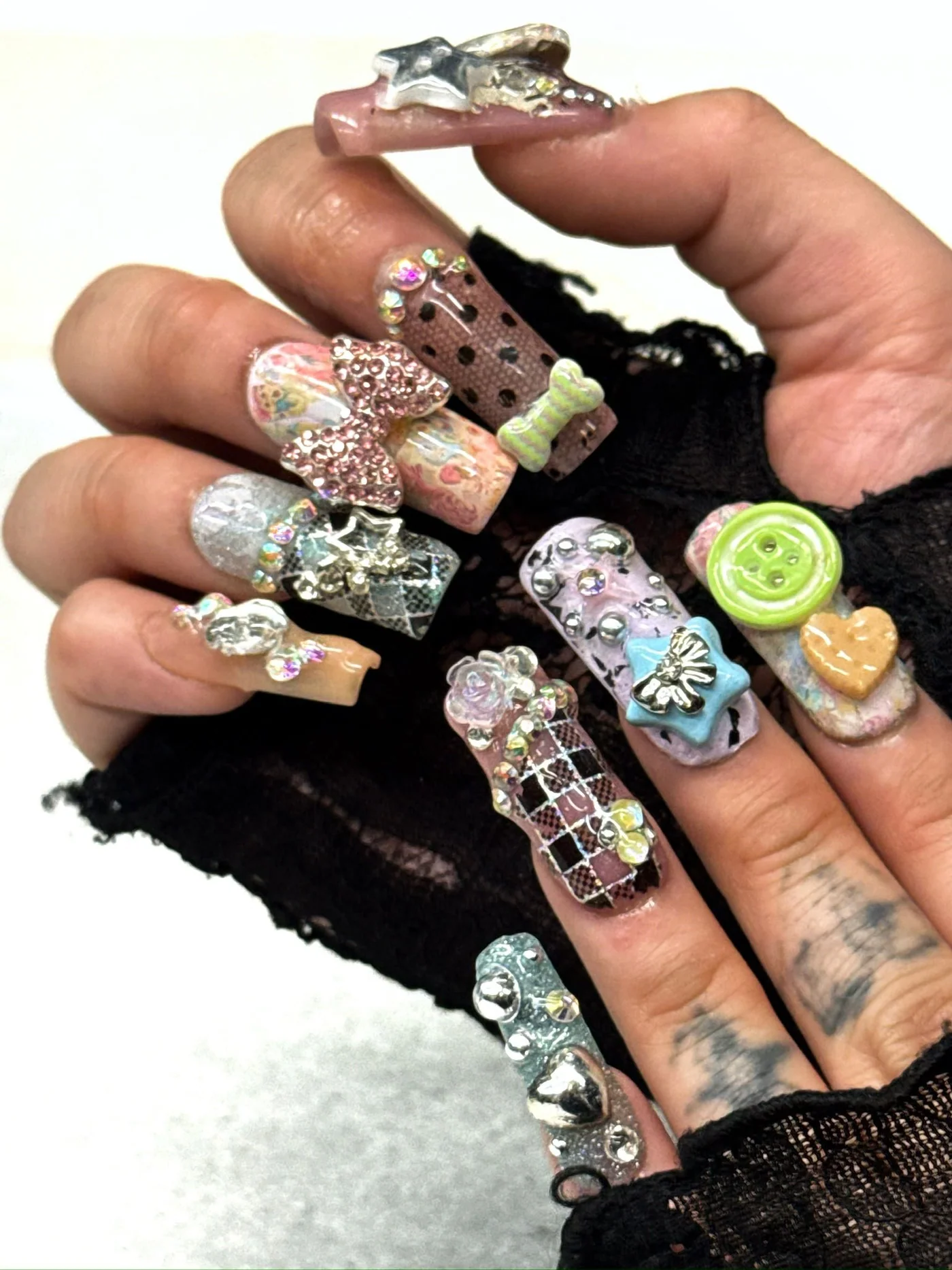 Custom nails with decorative pieces