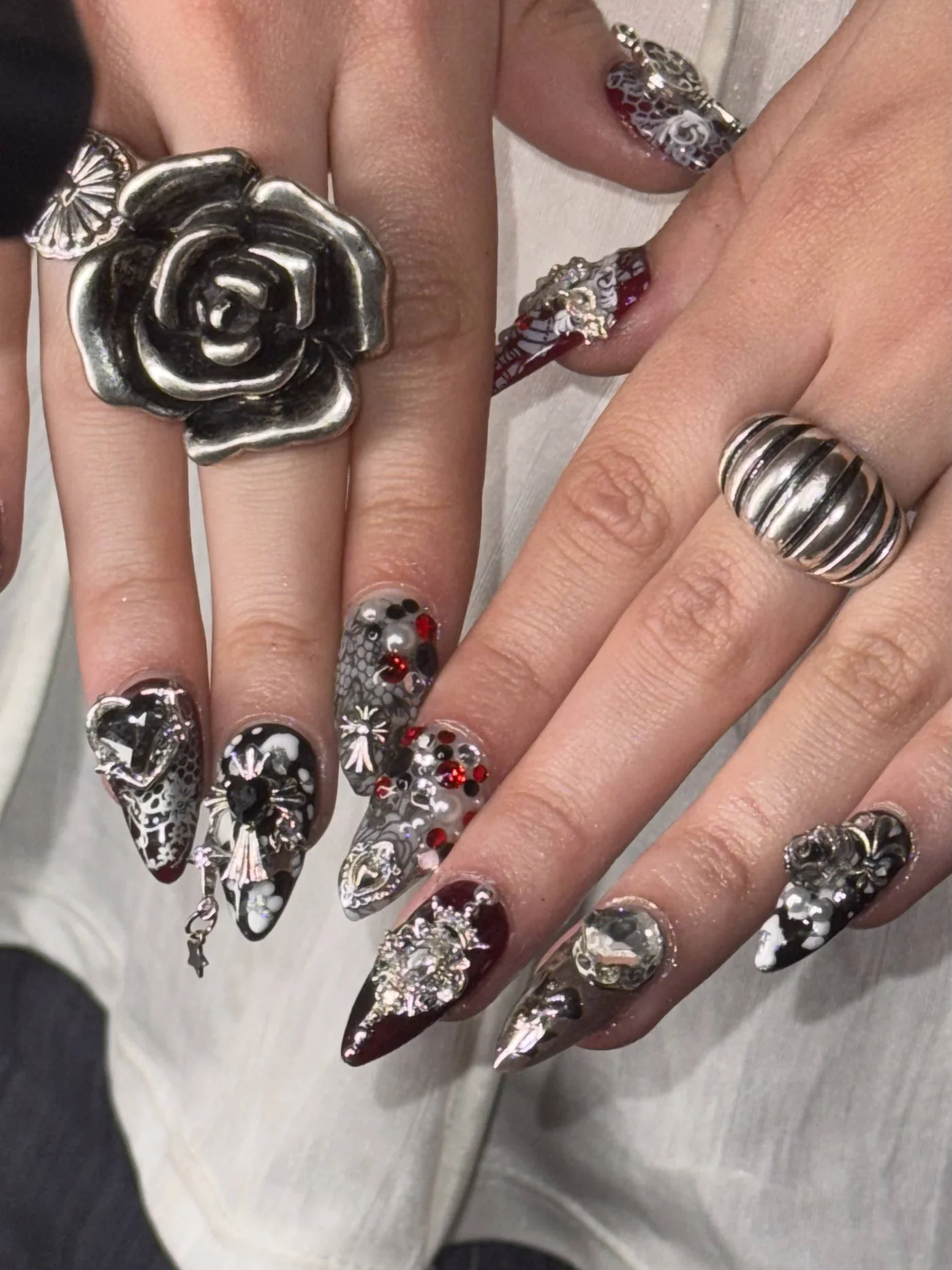Dark chrome sculptural nail art