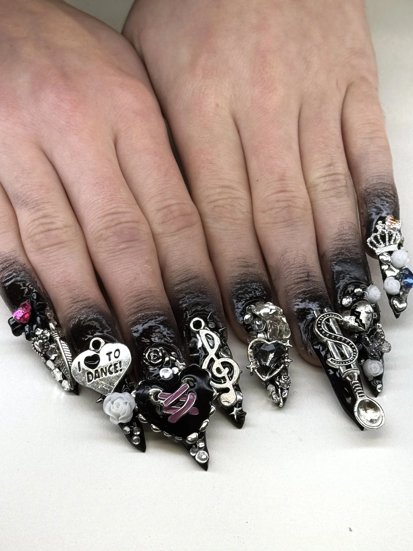 Detailed black charm nail designs